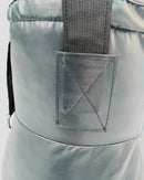 Close-up of a gray backpack with a pocket on a light gray background