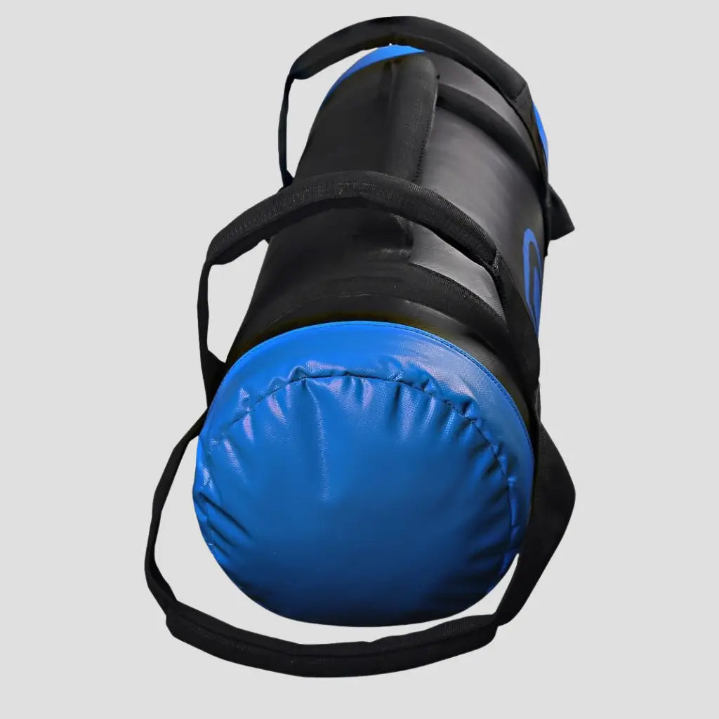 Blue sand bag with black straps on a light gray background