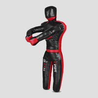 A black and red full-body MMA grappling dummy with a head and gloved hands, shown from the back against a light gray background.