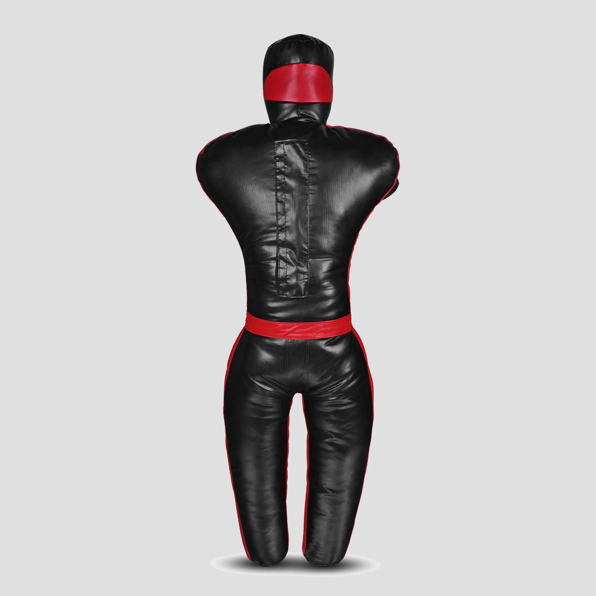 A black leather martial arts dummy with red trim and a red head band, shown from the back on a light gray background.