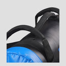 Close-up of a sleeping bag with blue bottom and black straps on a light gray background