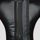 Close-up of the back of a black faux-leather or leather garment, showing a central vertical zipper, hook-and-loop fastening strips, and a thin red piping accent along the sides.