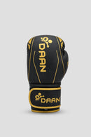 Single black and gold DAAN boxing glove with padded knuckles and secure wrist support for boxing training in Australia.