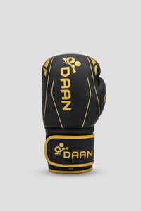 Single black and gold DAAN boxing glove with padded knuckles and secure wrist support for boxing training in Australia.
