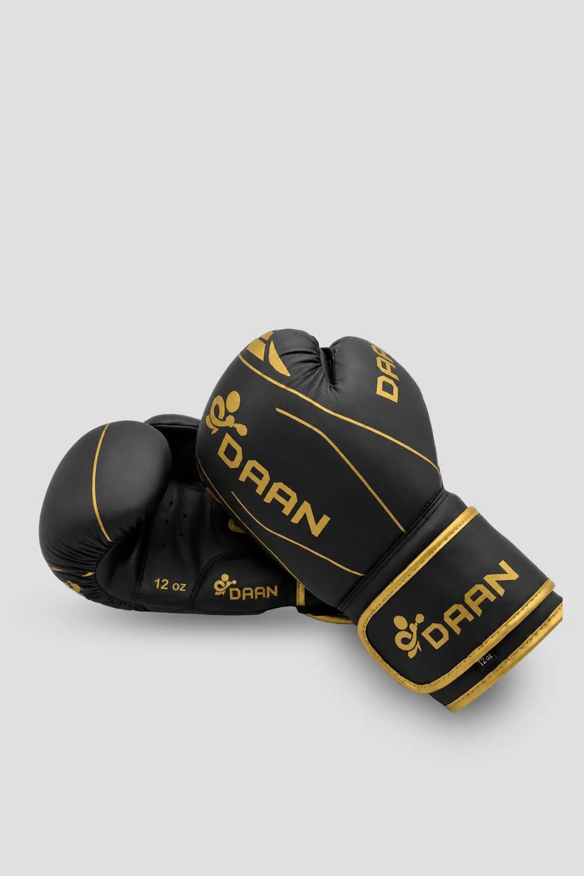 Pair of black and gold DAAN boxing gloves designed for bag work, pad training and regular boxing practice.