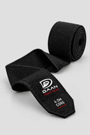 Black DAAN Core 4.5m boxing hand wrap unrolled, showing the stretch weave and labelled tail