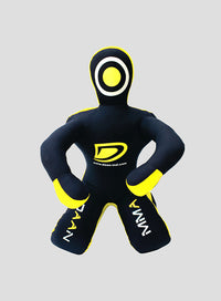 Black and yellow wrestling Dummy with brand logo on a gray background