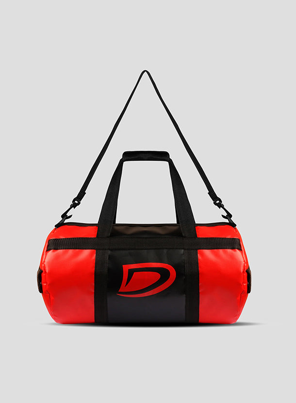 Red and black duffel bag with a brand logo on a gray background