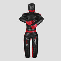 A black and red full-body martial arts dummy with a head and boxing gloves, shown from the back on a light gray background.