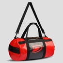 Red and black duffel bag with a logo on a light gray background